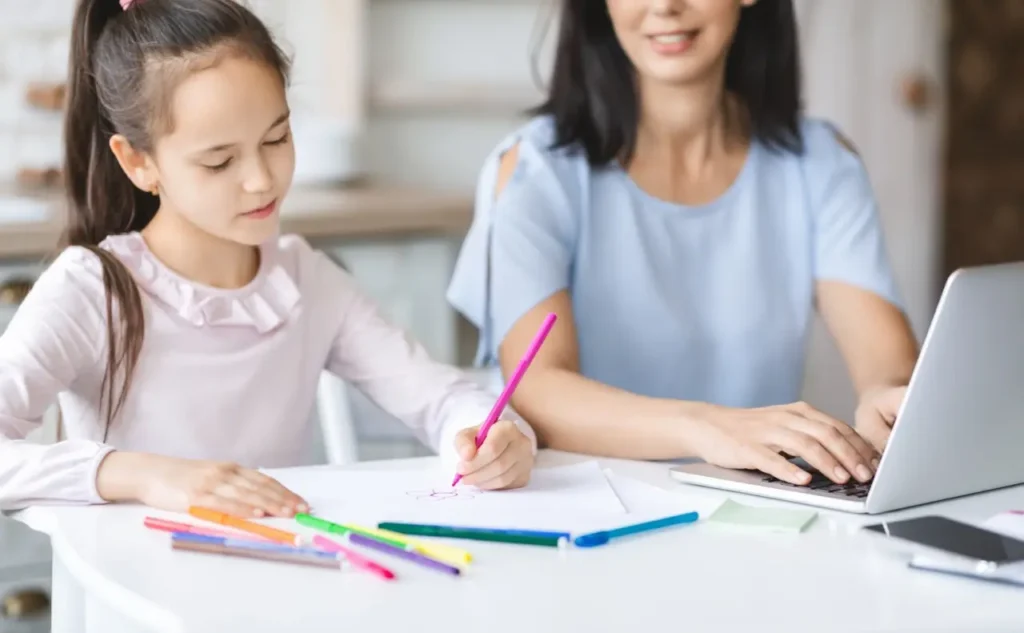 young girl drawing in art therapy
