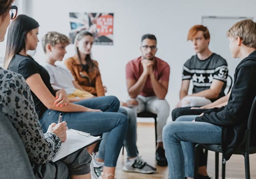 a group of teens participate in an aftercare rehab program 