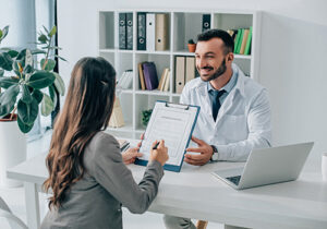 Doctor and health professional discuss Tufts Insurance Coverage