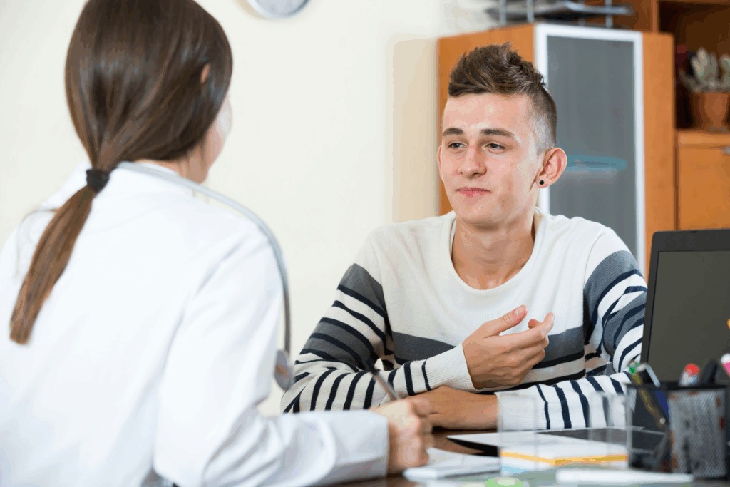 Teen in counseling session with therapist in Massachusetts, representing bipolar and addiction treatment at MCAW.